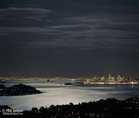 The San Francisco–Oakland Bay Bridge_Alcatraz and the San Francisco cityscape with full moonlight reflected on Richardson and San Francisco Bays_California_Rob Badger