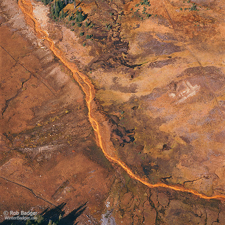 Aerial view of acid mine drainage from an abandoned gold mine polluting Stillwater Creek Gallatin National Forest Montana_Rob Badger
