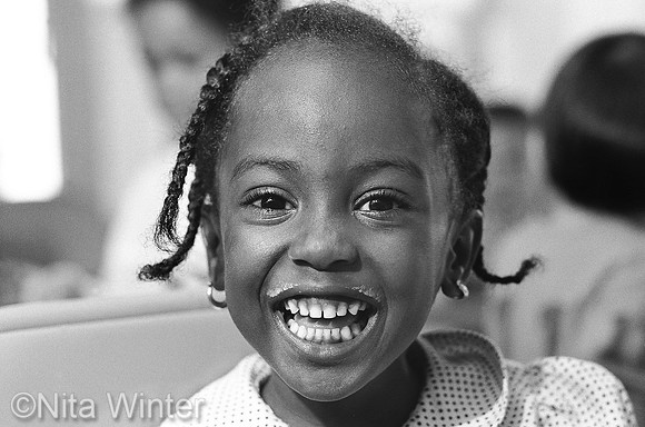 Girl with Milk Mustache at Glide Church Childcare, Tenderloin District, San Francisco