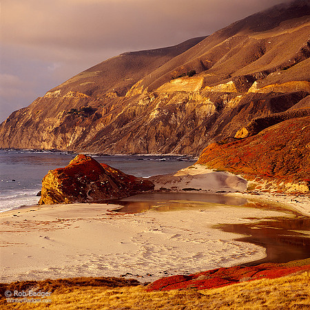 Sunset light on cliffs above beach at mouth of Little Sur River_Big Sur Coast_California_Rob Badger
